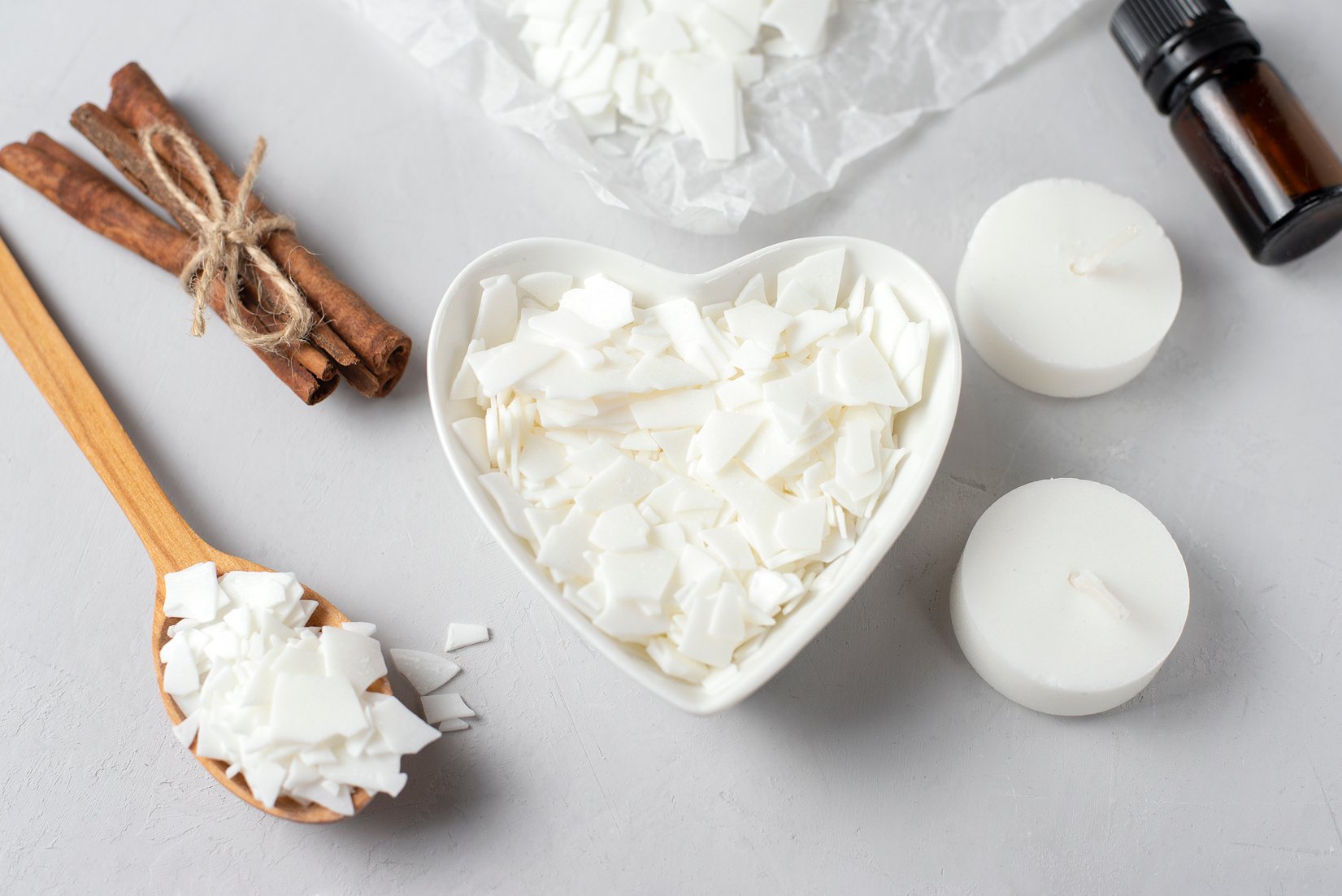 Basic set for home-made natural white eco soy wax candles in glass, wick, perfume. Idea for a hobby, business. Making trendy diy candles without harm to health on white background.